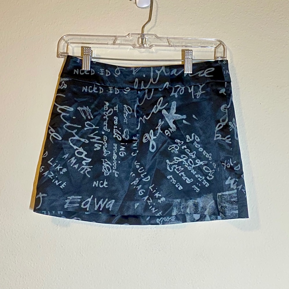 Bebe mini skirt with floral print size 2